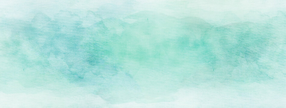 Mint green watercolor on white paper texture. Abstract stains pattern. Grunge background best for brochure, banner, wallpaper, mobile screen.	