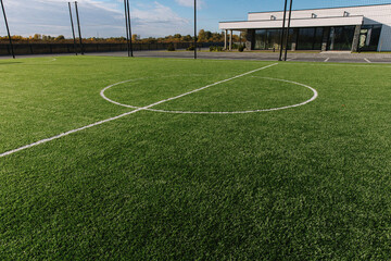 Detailed green soccer field grass lawn texture. White line in centre. Design stadium grass football. lineartificial surface
