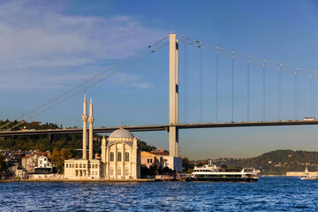 Grand Mecidiye Mosque and 15 July Martyrs Bridge with shores of Bosphorus in the background in Istanbul, Turkey.