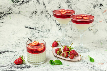 panna cotta dessert with strawberry and mint on a light background, top view