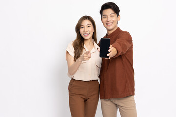 Young Asian couple holding and showing mobile phone application isolated on white background, Asian Thai model