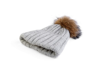 Gray winter hat with pompom isolated on white background.