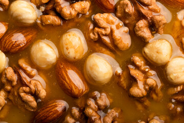 Honeyed assorted nuts organic food background flat view