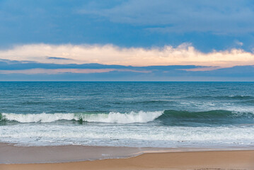Storm sea. Waves on the sea dispersed by the wind on a cloudy day.