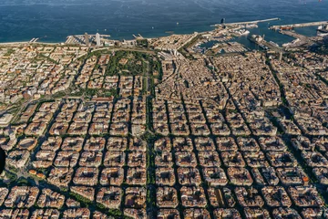 Tuinposter Aerial view of typical buildings of Barcelona cityscape from helicopter. top view, Eixample residencial famous urban grid © ikuday