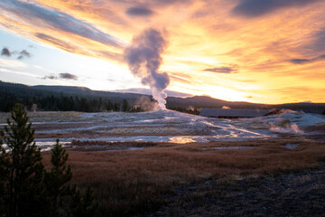 Old Faithful Erupting at Sunrise