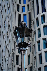 Modern shiny lantern on the futuristic building background, vertical