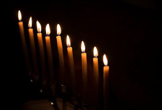Row of candles against black background