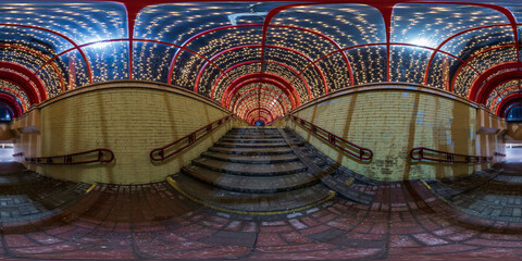 spherical night 360 panorama in festively lit underground passage tunnel with red frame arch and transparent dome and concrete staircase in equirectangular seamless projection, for VR AR content