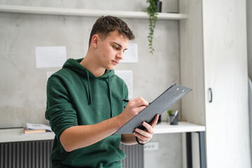 Young man caucasian teenager learning study at home education concept