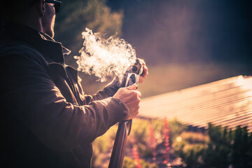 Male Hunter in a Smoke After a Shot