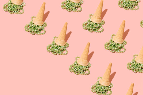 Bright Green Pearl Beads And Ice Cream Cones, Creative Aesthetic Pattern On A Pastel Pink Background. Summer Fashion Trend Idea. 