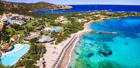 Poster Italy summer holidyas . Sardegna island - stunning Emerald coast (Costa Smeralda) with  beautiful beaches. aerial view of small Romazzino beach © Freesurf