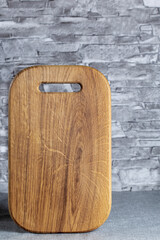 wooden cutting board on modern kitchen background, empty space for text