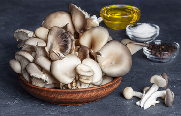 delicious organic oyster mushrooms in a bowl, top view