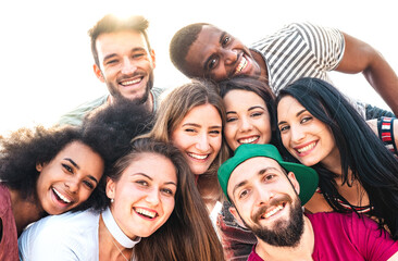 Multicultural guys and girls taking funny selfie - Happy millenial friendship and life style...