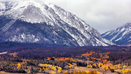 Autumn in Summit County, Colorado, brings golden colors to aspen trees and snow to Buffalo Mountain...