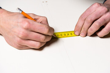 A carpenter works in a furniture workshop