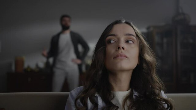 Close-up portrait of a young woman feeling depressed and hopeless by her violent husband blaming her