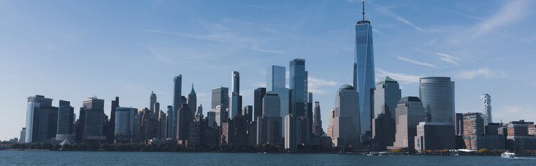Fototapeta na wymiar picturesque cityscape of Manhattan skyscrapers and Hudson river in New York City, banner.