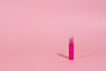 Pink lipstick on light pink background with no text