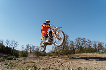 Man riding motorbike on motocross track.Extreme and Adrenaline. Motocross rider in action....