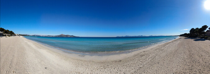 Panoramic view of Playa de Muro  in Majorca. Beautiful scene of the seacost with a blue sea and Mediterranean landscape