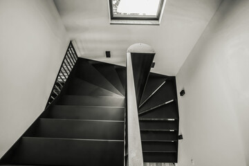 Black steel stairs in an industrial style in a modern house