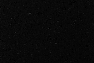 Water drops on dark stone