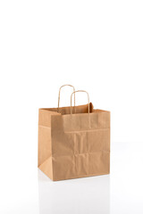 Paper shopping bag on white