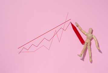 Wooden mannequin and graph with growing indicators, high income. Pink background