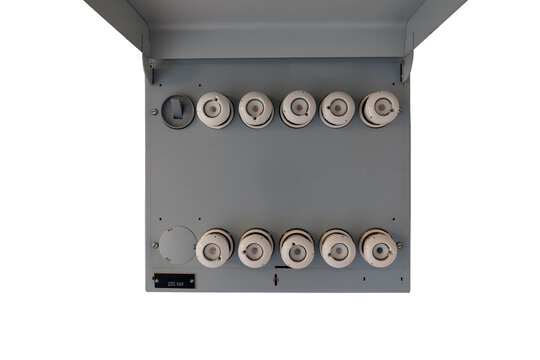 Old electrical fuse box with porcelain fuses in an older dwelling house, power and energy concept. Isolated on white background.