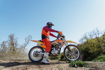 Man riding motorbike on motocross track.Extreme and Adrenaline. Motocross rider in action. Motocross sport. Active lifestyle