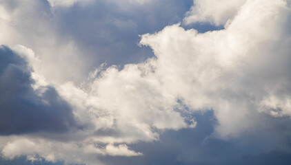 Obraz premium Beautiful huge fluffy clouds on the blue sky. Sky clouds background.