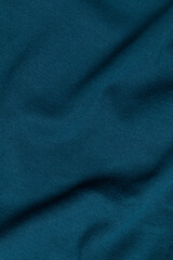 Crumpled blue textile. Full frame, top view.