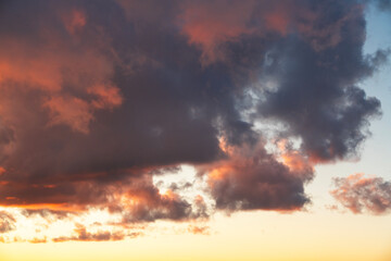 Beautiful orange bright sunset sky with dramatic clouds. Sunset sky background.