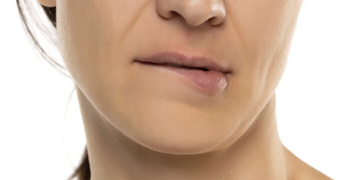 Close-up of woman biting on her lip