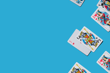 Face cards queens kings jacks aces on a blue background