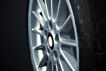 old car wheels titanium rims long exposure video on dark background spinning motion simulation