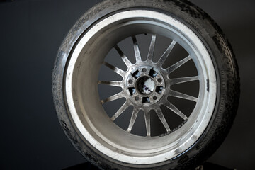 old car wheels titanium rims long exposure video on dark background spinning motion simulation