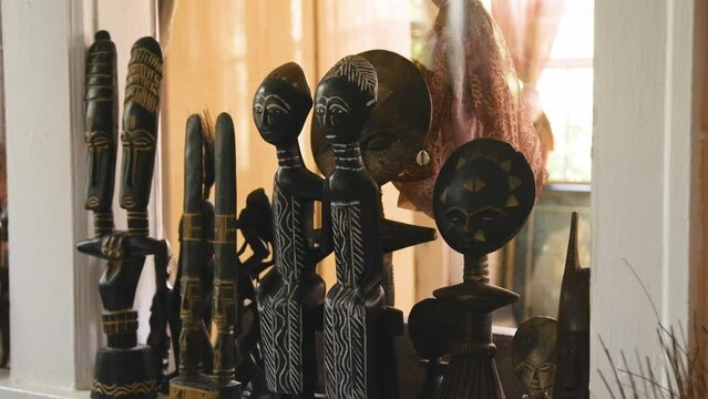 Black Stock Footage of historic African Art, Masks, Artifacts, and Sculptures in a home museum showcasing the diversity of African descendents, cultures, and creativity