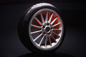 old car wheels titanium rims long exposure video on dark background spinning motion simulation