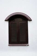 Brown vintage wood window on white wall