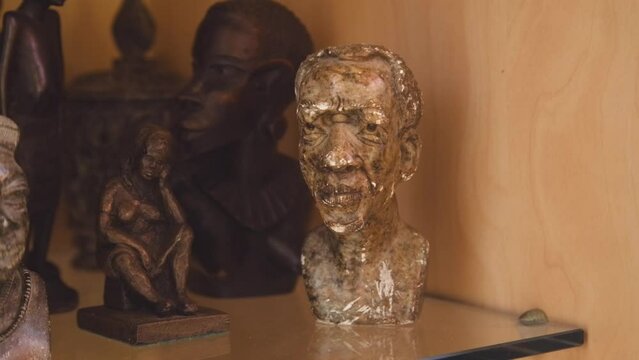 Black Stock Footage of historic African Art, Masks, Artifacts, and Sculptures in a home museum showcasing the diversity of African descendents, cultures, and creativity