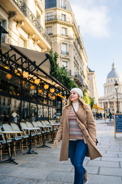 Smiling lady exploring city during sightseeing trip