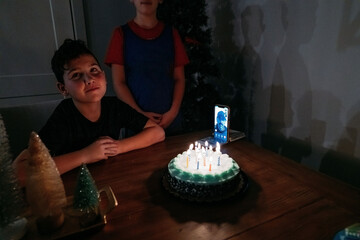 A boy smiling on his birthday. 