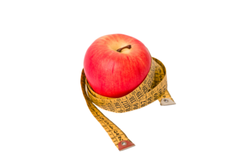 Measuring tape and red apple isolated on white background