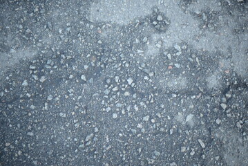 gray concrete pavement texture on asphalt, painted asphalt texture, gray cracked texture, cracks on rough asphalt surface on gray asphalt, pedestrian crossing, old wet pavement texture close up