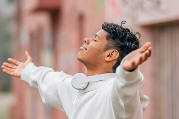 happy young man enjoying relaxed in the street