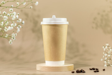 Coffee to go. Spring composition with disposable eco friendly cardboard cup with coffee beans on beige background with white flowers. Takeaway coffee concept. Mockup, front view